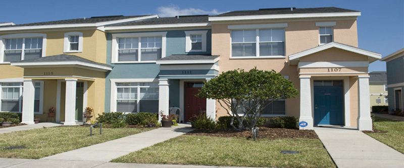 Multi-unit buildings at The Landings at Carver Park painted in several colors.
