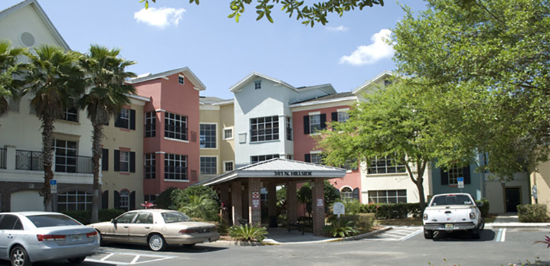 A multi-colored three-story building at The Villas at Hampton Park.